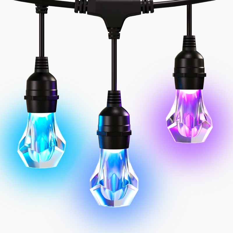 Close up of outdoor string lights LED bulbs on a white background showcasing multiple colors.